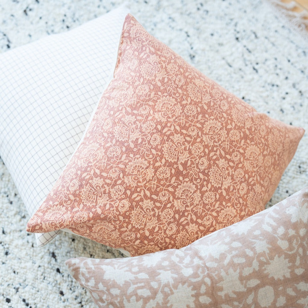 Doreen pillow cover shown with neutral and blush tones