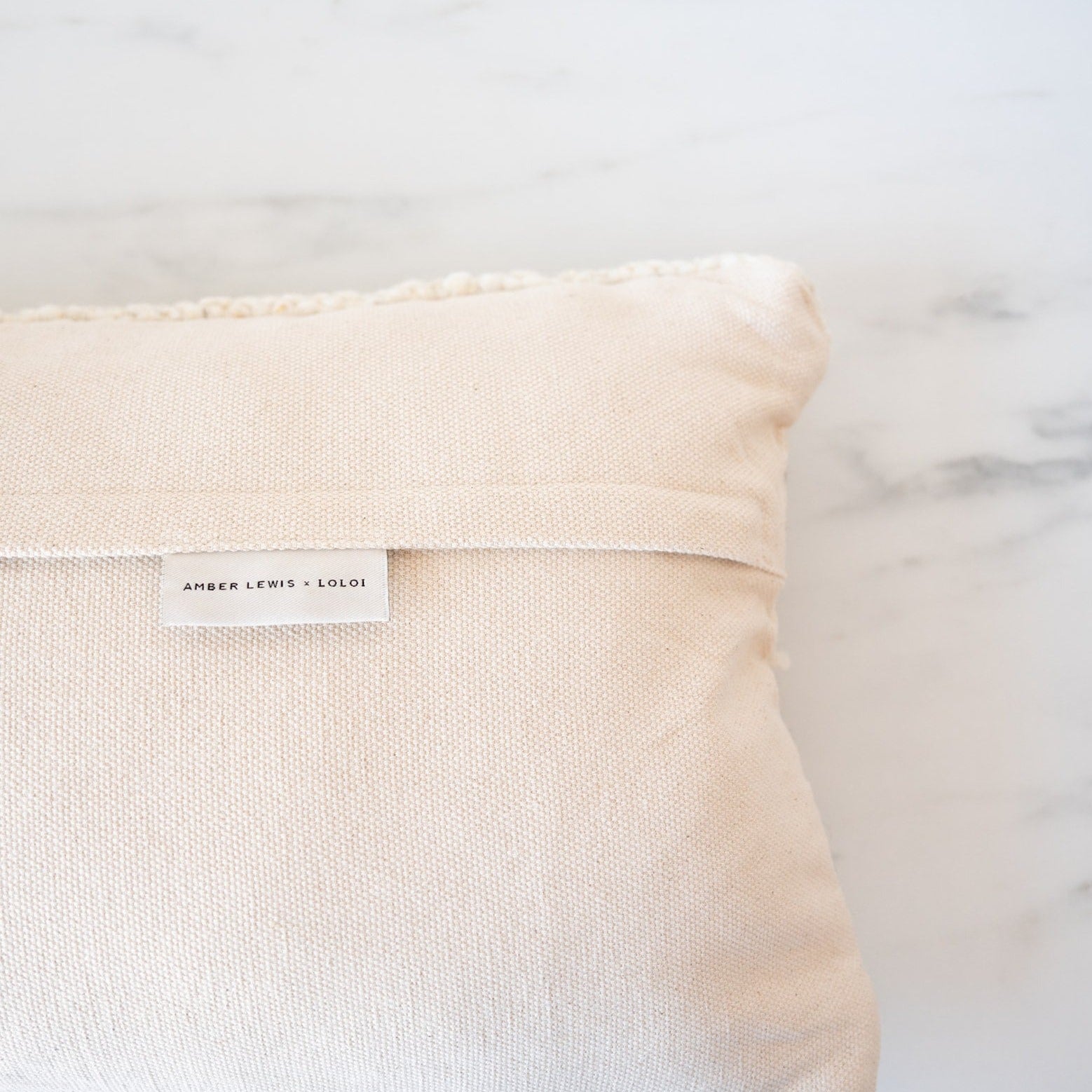 Neutral pillow with creamy cotton backing with concealed zipper